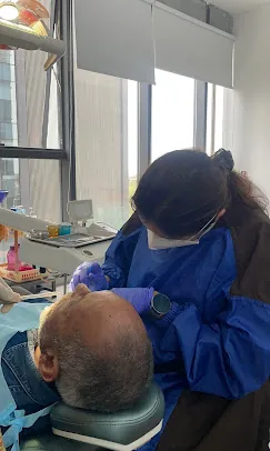 Dr. Puja Bansal using modern dental equipment at Prudent Dental Clinic, minutes from Yerwada, Pune