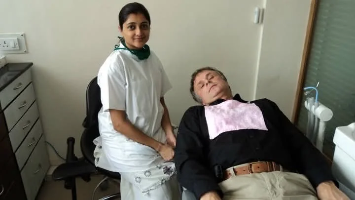An international patient in the dental chair with Dr. Puja Bansal at Prudent Dental Clinic, Viman Nagar
