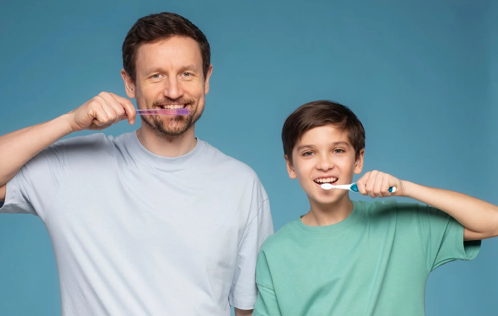 A parent and child brushing their teeth together, kids dental care in Viman Nagar, Pune